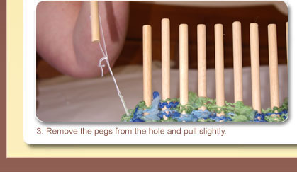 3. Remove the pegs from the hole and pull slightly